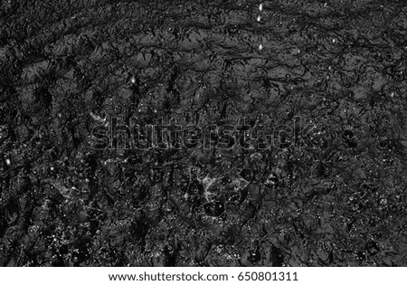 Motion wave of water surface background texture in black and white