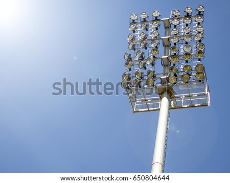 Stadium light against blue sky
