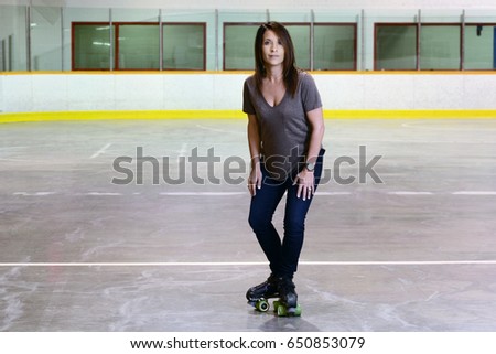 woman doing t stop move on quad roller skates