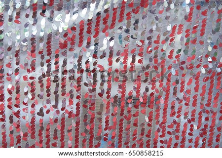 View of close up small pieced of  red rounded metal arranging in a row as a reflection.