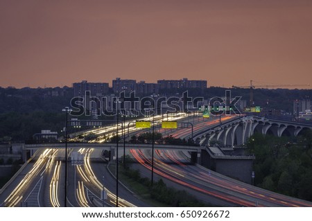 Long exposure light trails of traffic on the Woodrow Wilson Bridge in Alexandria Virginia