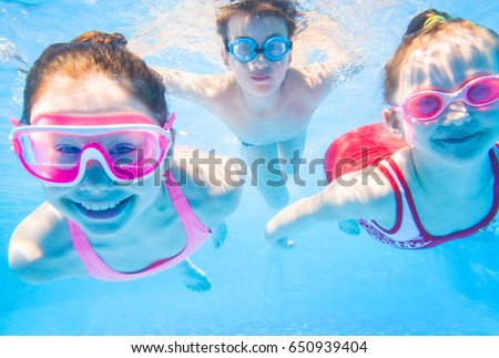 little kids swimming  in pool