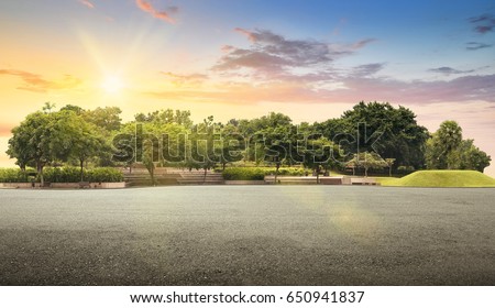 Empty street at the nice and comfortable garden at the morning with lovely beautiful sky Royalty-Free Stock Photo #650941837