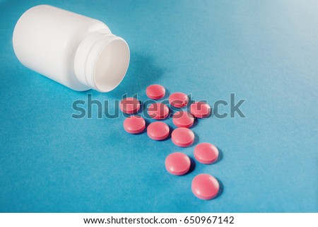 medical pills round shape and bright bottle
