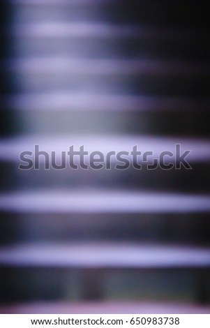 Abstract pictures; Blurred purple vintage stairs; Light shines part of the stairs.