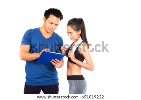Handsome personal trainer with a attractive girl on a white background,
Fitness course
