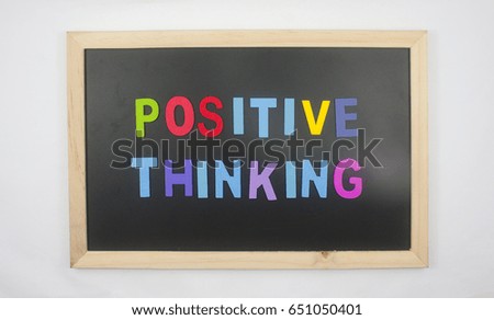 mini blackboard with wooden block text positive thinking concept isolated on white background