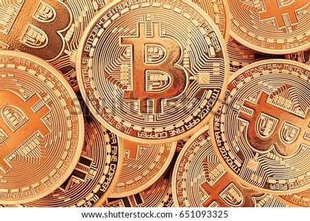 Golden Bitcoins close-up as a background.Photo (new virtual money ) .Conceptual photo. 