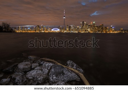 The emblematic CN tower of toronto with cloud skyline cityscape at sunset, ontario canada