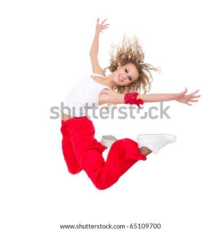 Happy young dancer jumping against isolated white background