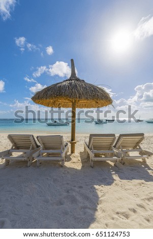 Beach umbrellas Trou Aux Tropical Beach on Mauritius Island