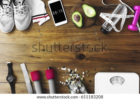 Healthy Living Lifetsyle Exercise Stuff on Wooden Table Royalty-Free Stock Photo #651183208