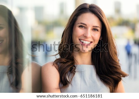Naturally beautiful woman with perfect white teeth smile, genuine, positive, happy, smiling Royalty-Free Stock Photo #651186181