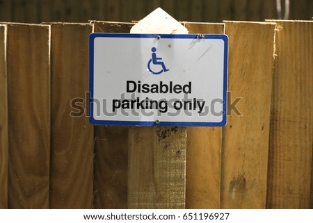 Signpost: "Disabled Parking Only" with wheelchair logo