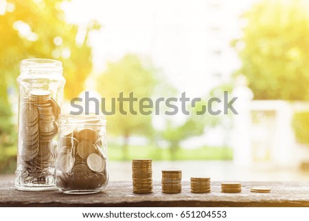 Growing silver coins and saving money step succeed blur bokeh background