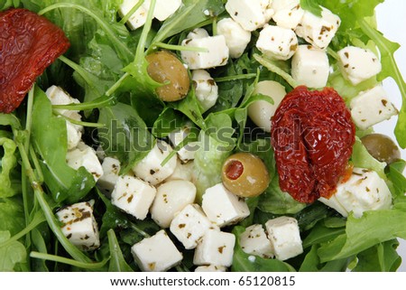 Fresh salad mix with feta and dry tomatos