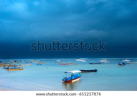 Lots of fisher boats in the ocean in the strom. Bali island, Indonesia