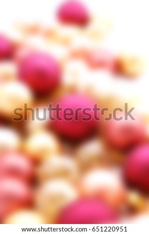 Long row of Christmas ornaments on white - blurred image for backgrounds