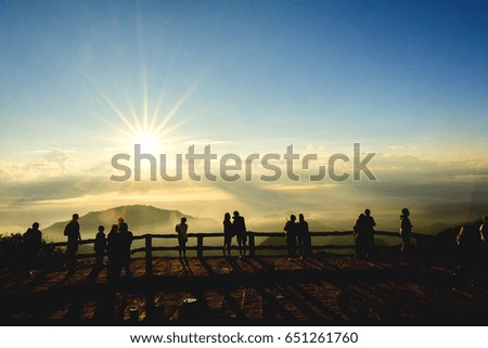 Silhouette peoples on top the mountain view point and sunlight at Mon son view point Doi Pha Hom Pok National Park, Doi AngKhang, Thailand