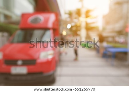 blurred background red mini van food trucks parking service foods with warm sunlight