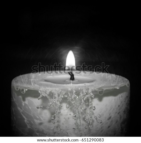 A black and white dripping candle wallpaper design. 