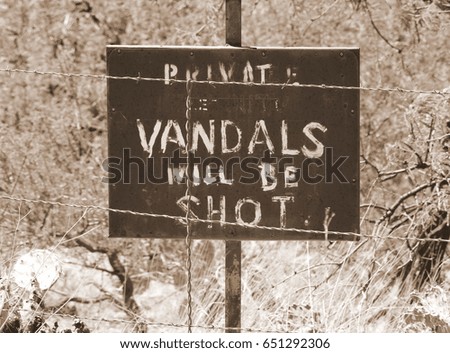 Desert Vandal Warning Sign