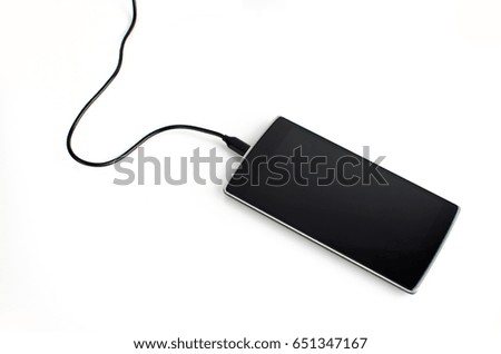 Black Smart Phone With Plugged Cable On White Background