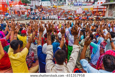 Thousands of Hindu Pilgrims/ People in the holy city of Haridwar in Uttarakhand, India during the evening light ceremony called Ganga arthi to worship river Ganga / Ganges. Culture, Tradition,ceremony Royalty-Free Stock Photo #651357958