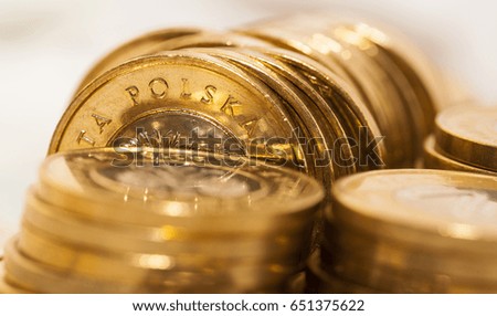   photographed close-up Polish coins. Zloty stacked together, shallow depth of field