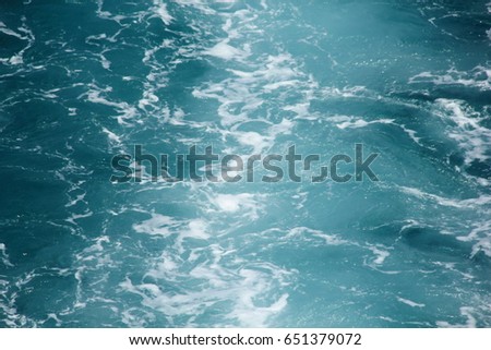 Blue tropical sea surface with waves on the top view