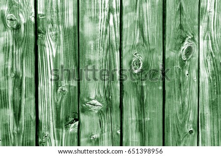 Green toned wood fence pattern. abstract background and texture for design.