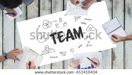 Digital composite of Team text by icons and business people on table