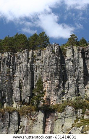 Basaltic columns in Black Lagoon of Picos de Urbión, Soria, Spain,