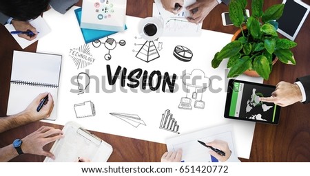 Digital composite of Vision text by icons and business people on table
