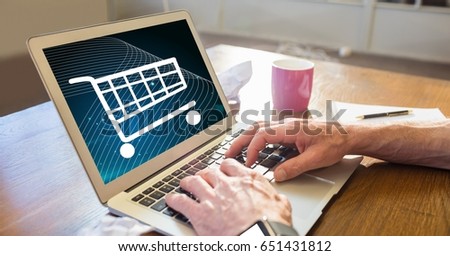Digital composite of Businessman shopping online using laptop