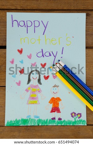 Hand drawn happy mothers day greeting card on wooden background