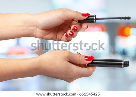 female hand holding a professional makeup brush