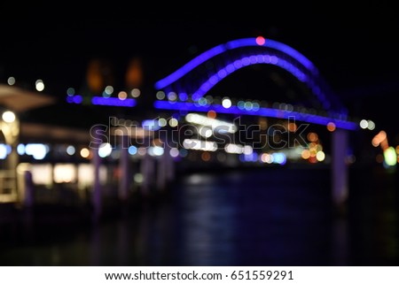 Bokeh with yellow, blue and purple colors, Night city lights background. Blurred Bokeh light vintage background, Abstract colorful defocused dot, Soft focus. Bokeh Sydney Harbour Bridge.