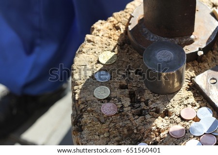 Coinage equipment. Coins. Royalty-Free Stock Photo #651560401