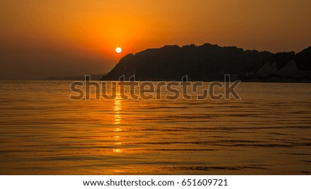 Sunset with mountain and sea