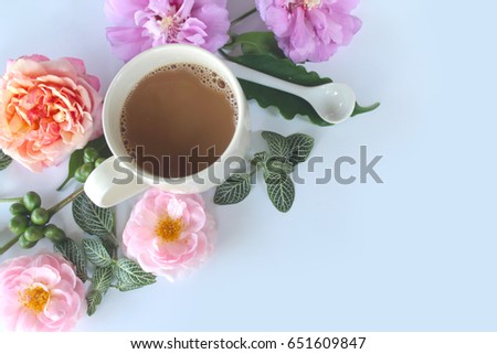 Cup of coffee with flower ,top view
