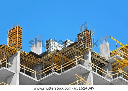 Building construction site work against blue sky Royalty-Free Stock Photo #651624349