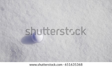Ggolf ball on the snow. 