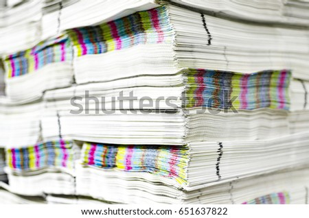 Pile of paper documents with cmyk printed color bars