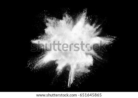 Freeze motion of white color powder exploding on black background. Royalty-Free Stock Photo #651645865
