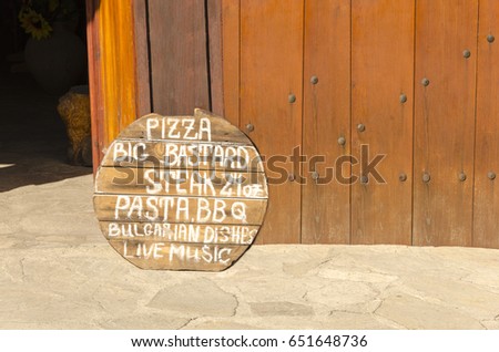 Old wooden restaurant and pizzeria sign