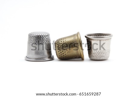 Metal thimble on a white background isolated