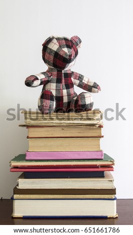 Vintage books with teddy bear