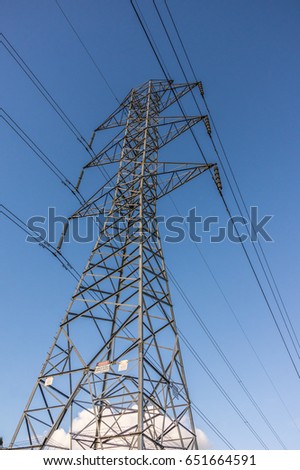 Electricity supply towers and structures transmit power along high voltage wires and cables