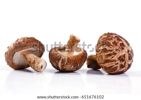 Fresh Shiitake mushroom  isolated on white background. Royalty-Free Stock Photo #651676102